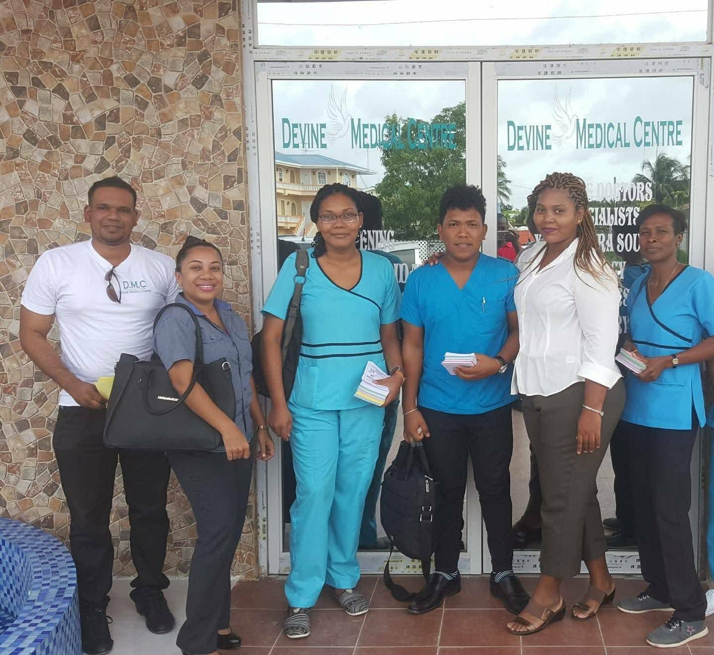 Dr. Antony with the medical outreach team outside Devine Medical Centre